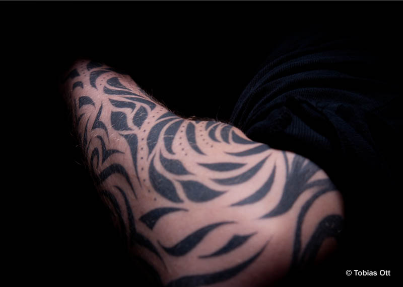 Tribal Muster auf einem Arm